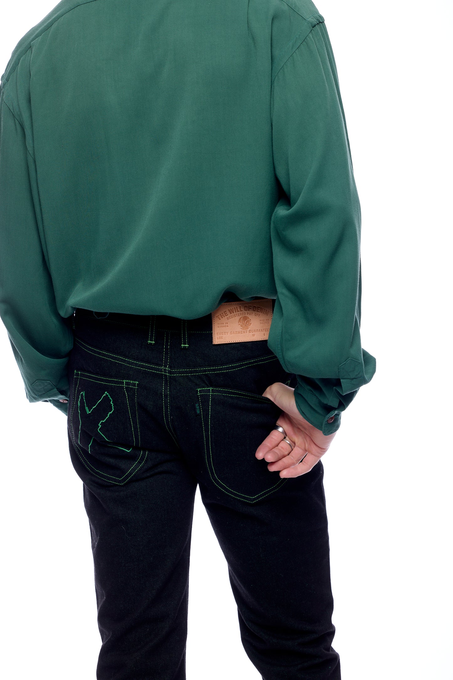 Back view with green stitching, X and tag visible