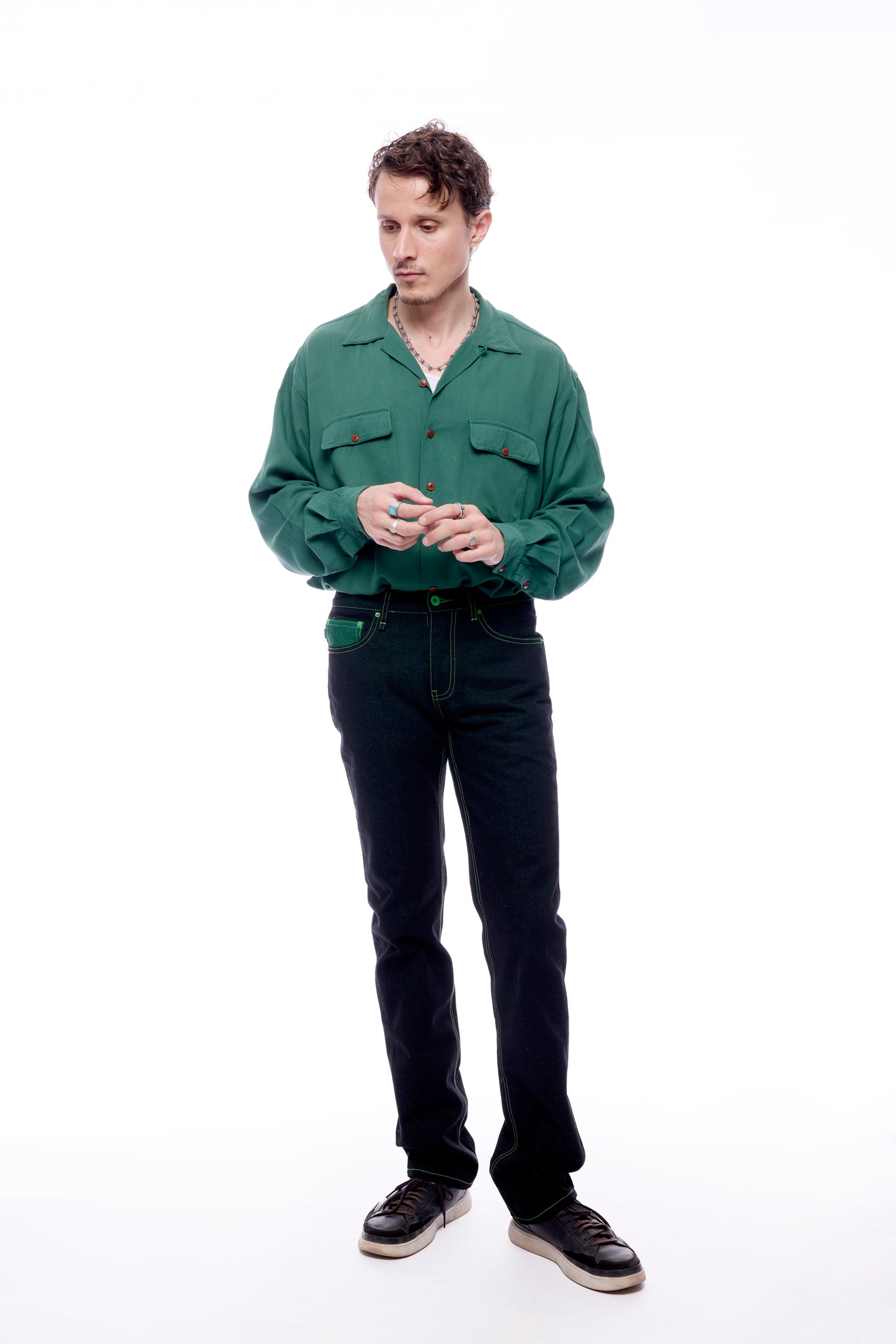 Model 1 wearing the Greatest Swordsman Black+Green Jeans